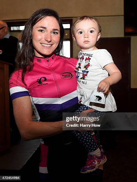 Dame Sarah Storey riding for Pearl Izumi-Sports Tours holds daughter at the 2015 Team Presentation ahead of the 2015 AMGEN Tour of California Women's...