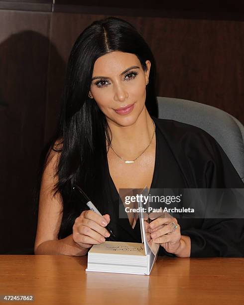 Reality TV Personality Kim Kardashian West signs copies of her new book "Selfish" at Barnes & Noble bookstore at The Grove on May 7, 2015 in Los...