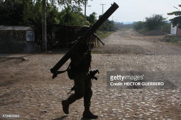 Mexican soldier stands guard in Villa Purificacion, Jalisco State, Mexico on May 7 during the "Jalisco operation". The death toll from a Mexican drug...