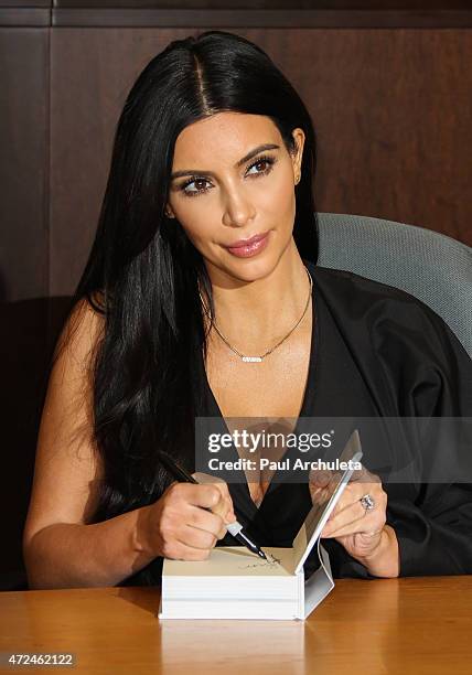 Reality TV Personality Kim Kardashian signs copies of her new book "Selfish" at Barnes & Noble bookstore at The Grove on May 7, 2015 in Los Angeles,...