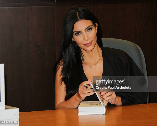 Reality TV Personality Kim Kardashian signs copies of her new book "Selfish" at Barnes & Noble bookstore at The Grove on May 7, 2015 in Los Angeles,...