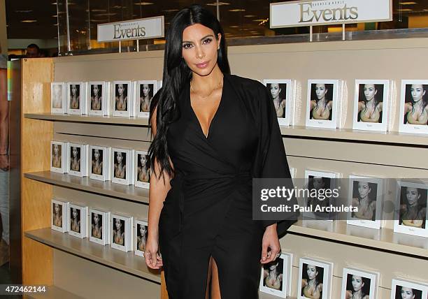 Reality TV Personality Kim Kardashian signs copies of her new book "Selfish" at Barnes & Noble bookstore at The Grove on May 7, 2015 in Los Angeles,...