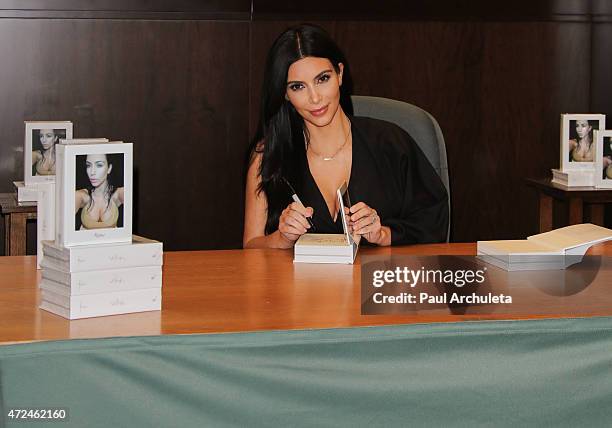 Reality TV Personality Kim Kardashian signs copies of her new book "Selfish" at Barnes & Noble bookstore at The Grove on May 7, 2015 in Los Angeles,...