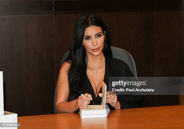 Reality TV Personality Kim Kardashian signs copies of her new book "Selfish" at Barnes & Noble bookstore at The Grove on May 7, 2015 in Los Angeles,...