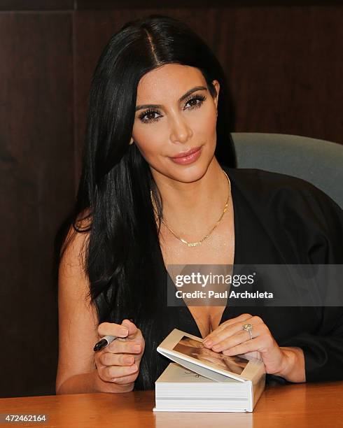 Reality TV Personality Kim Kardashian signs copies of her new book "Selfish" at Barnes & Noble bookstore at The Grove on May 7, 2015 in Los Angeles,...