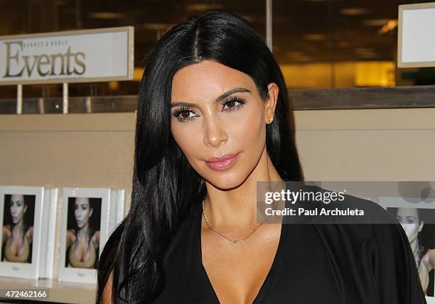 Reality TV Personality Kim Kardashian signs copies of her new book "Selfish" at Barnes & Noble bookstore at The Grove on May 7, 2015 in Los Angeles,...