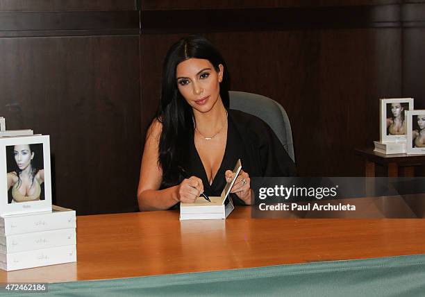 Reality TV Personality Kim Kardashian signs copies of her new book "Selfish" at Barnes & Noble bookstore at The Grove on May 7, 2015 in Los Angeles,...