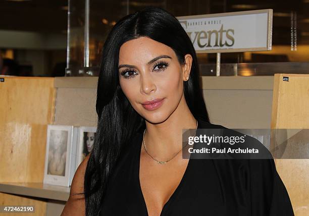 Reality TV Personality Kim Kardashian signs copies of her new book "Selfish" at Barnes & Noble bookstore at The Grove on May 7, 2015 in Los Angeles,...