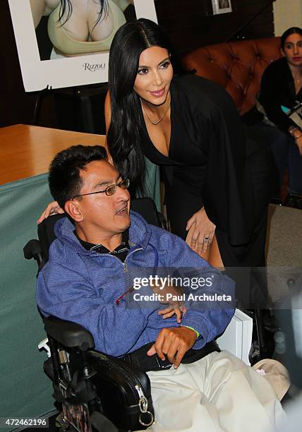 Reality TV Personality Kim Kardashian signs copies of her new book "Selfish" at Barnes & Noble bookstore at The Grove on May 7, 2015 in Los Angeles,...