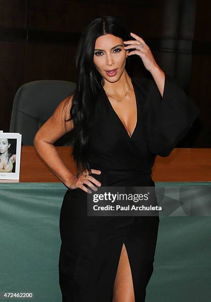 Reality TV Personality Kim Kardashian signs copies of her new book "Selfish" at Barnes & Noble bookstore at The Grove on May 7, 2015 in Los Angeles,...