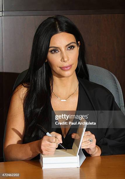 Reality TV Personality Kim Kardashian signs copies of her new book "Selfish" at Barnes & Noble bookstore at The Grove on May 7, 2015 in Los Angeles,...