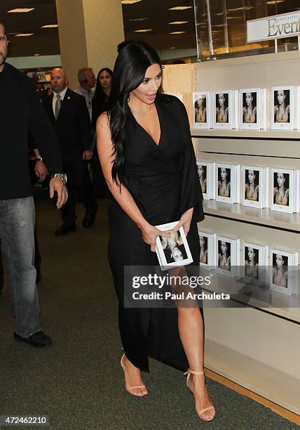 Reality TV Personality Kim Kardashian signs copies of her new book "Selfish" at Barnes & Noble bookstore at The Grove on May 7, 2015 in Los Angeles,...