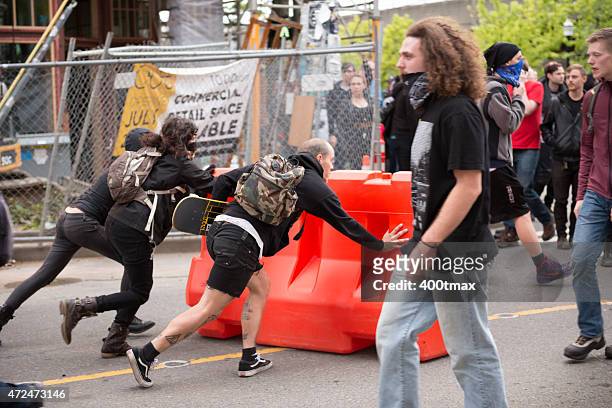 seattle protestors - riot shield stock pictures, royalty-free photos & images