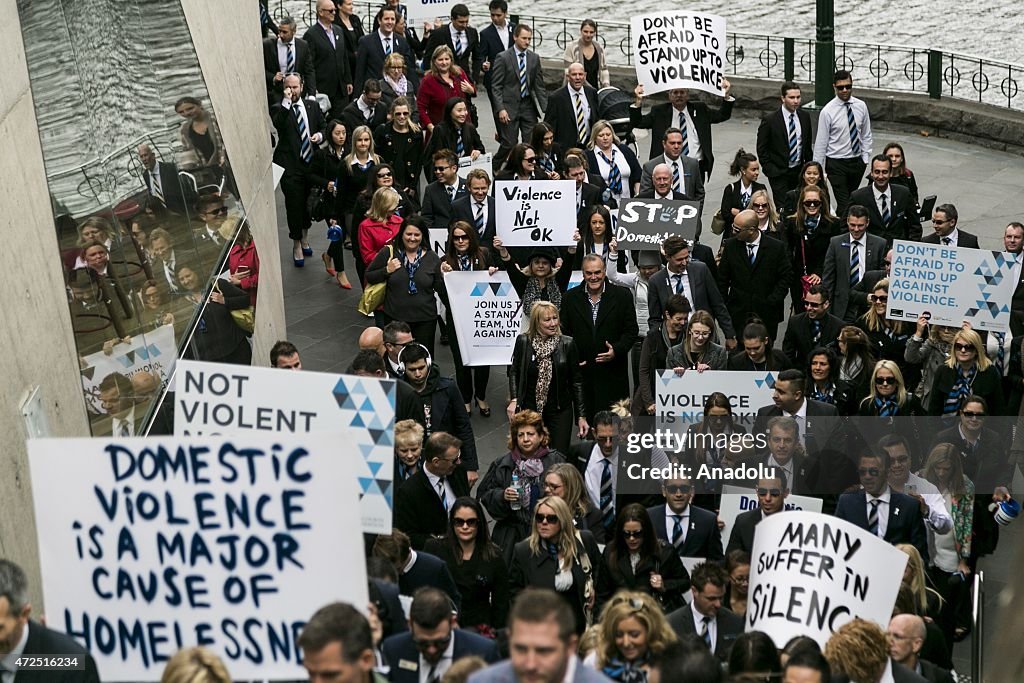 Dv Protest Protestors holding banners march during a protest against Domestic ...