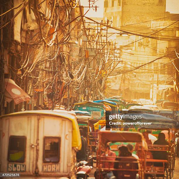 sunset street in old delhi, india - old delhi stock pictures, royalty-free photos & images