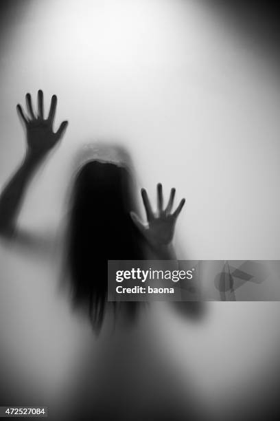woman silhouette - a haunted house stockfoto's en -beelden