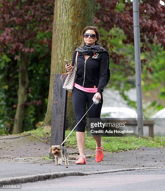 Jessica Wright is pictured taking her pet dog out for a morning walk on May 6, 2015 in London, England.