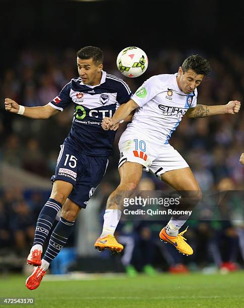 Daniel Georgievski of the Victory and Robert Koren of City contest to head the ball during the A-League semi final match between Melbourne Victory...