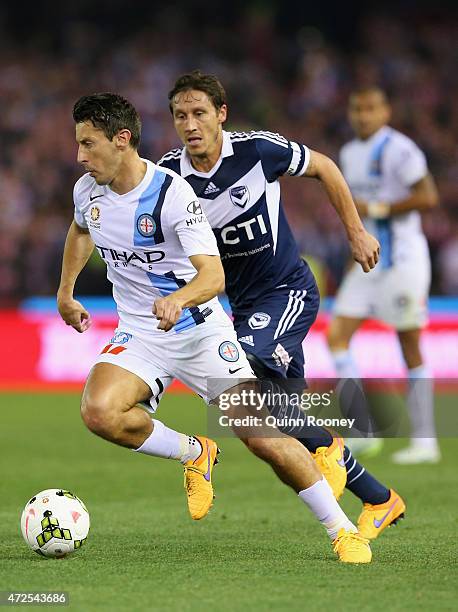 Robert Koren of City and Mark Milligan of the Victory compete for the ball during the A-League semi final match between Melbourne Victory and...