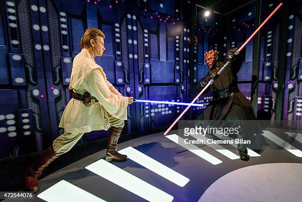 Wax figures of the Star Wars characters Obi-Wan Kenobi and Darth Maul are displayed on the occasion of Madame Tussauds Berlin Presents New Star Wars...