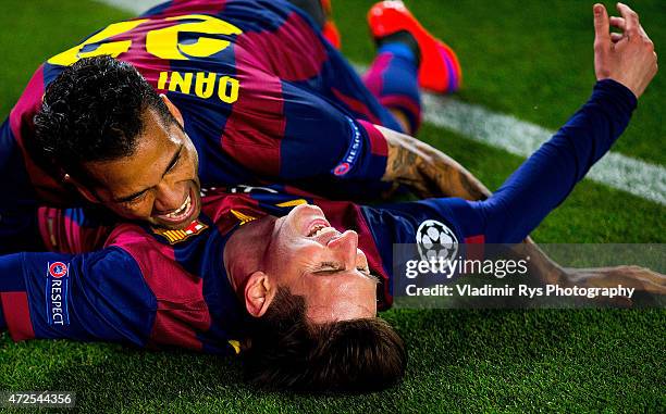 Lionel Messi of Barcelona celebrates with his team mate Daniel Alves after scoring his second goal during the first leg of UEFA Champions League...