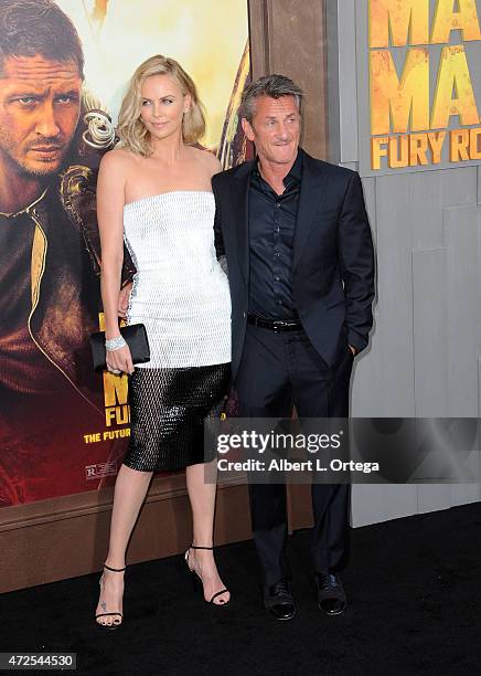 Actress Charlize Theron and actor Sean Penn arrive for the Premiere Of Warner Bros. Pictures' "Mad Max: Fury Road" held at TCL Chinese Theatre on May...