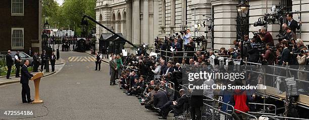 Prime Minister David Cameron delivers brief remarks to the news media in front of 10 Downing Street after returning from Buckingham Palace on May 8,...