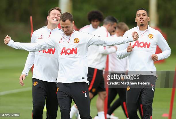 Phil Jones, Jonny Evans and Chris Smalling of Manchester United in action during a first team training session at Aon Training Complex on May 8, 2015...