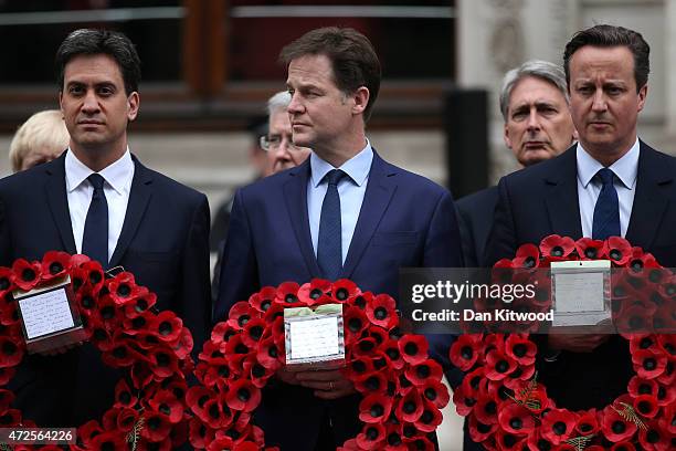 Labour Party leader Ed Miliband, Liberal Democrat leader Nick Clegg and Prime Minister David Cameron prepare to place a wreath during a tribute at...