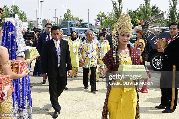 Malaysia's vice Prime Minister Yab Tan Sri Muhyiddin Yassin attends a show at the Pavilion of Malaysia on May 8 during the Expo 2015, Universal...