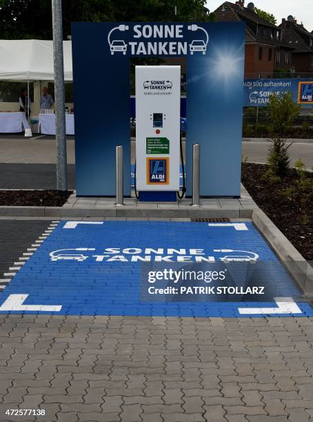 New charging station for electro cars is seem at the carpark in front of an Aldi South supermarket discount store on May 8, 2015 in Duesseldorf,...