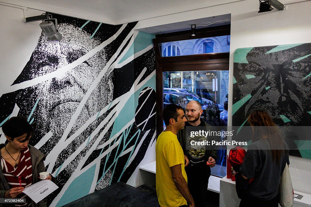 The Portuguese street artists'  Daniel Eime  works at "Menta...