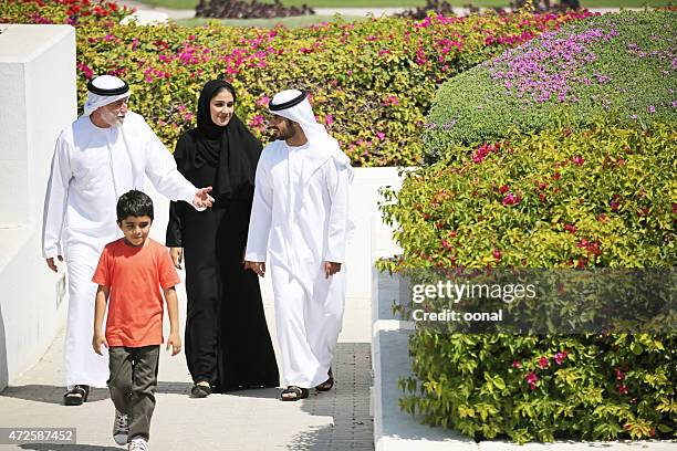 arab family enjoying their leisure time in park - saudi grandfather stock pictures, royalty-free photos & images