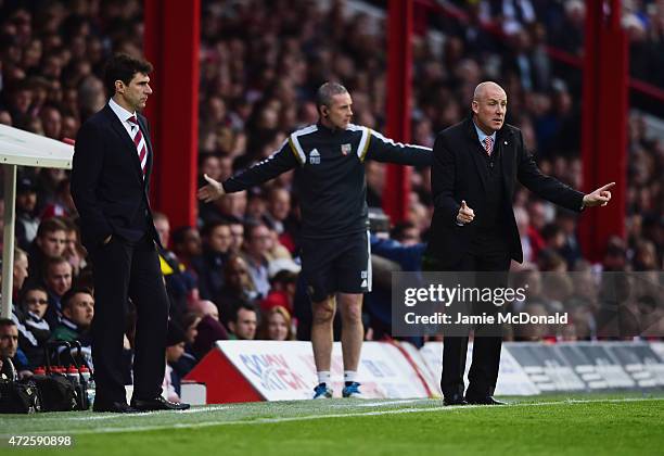 Mark Warburton manager of Brentford signals as Aitor Karanka manager of Middlesbrough looks on during the Sky Bet Championship Playoff semi-final...