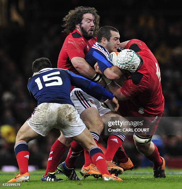 Wales prop Adam Jones tackles France number 8 Louis Picamoles during the Six Nations international rugby union match between Wales and France at the...