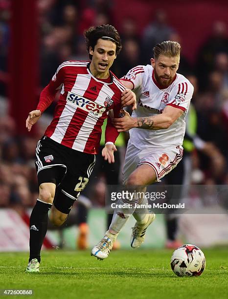 Jota of Brentford takes on Adam Clayton of Middlesbrough during the Sky Bet Championship Playoff semi-final first leg match between Brentford and...