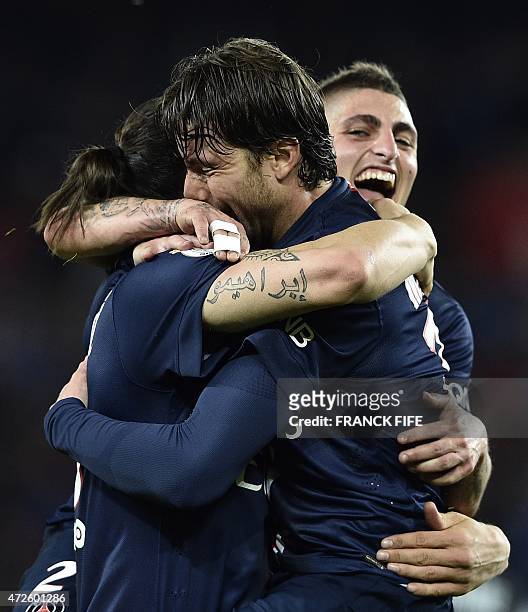 Paris Saint-Germain's Brazilian defender Maxwell is congratuled by Paris Saint-Germain's Swedish forward Zlatan Ibrahimovic after scoring a goal...