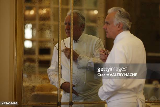 French chef Alain Ducasse poses in the "Louis XV" new dining restaurant in the Hotel de Paris, on May 8, 2015 in Monaco. AFP PHOTO / VALERY HACHE