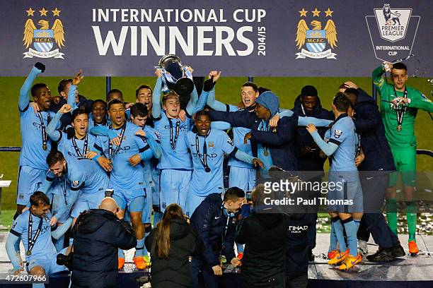Manchester City players celebrate with the trophy after the Premier League International Cup Final match between Manchester City and FC Porto at the...
