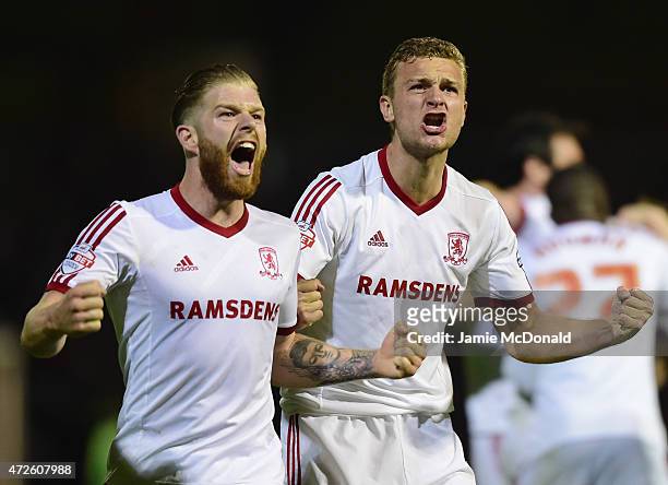 Adam Clayton and Ben Gibson of Middlesbrough celebrate during the Sky Bet Championship Playoff semi-final first leg match between Brentford and...