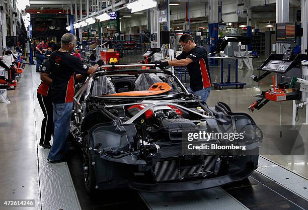 Employees manufacture a Fiat Chrysler Automobiles NV 2015 Dodge Viper vehicle on the production line at the FCA US Conner Avenue assembly plant in...