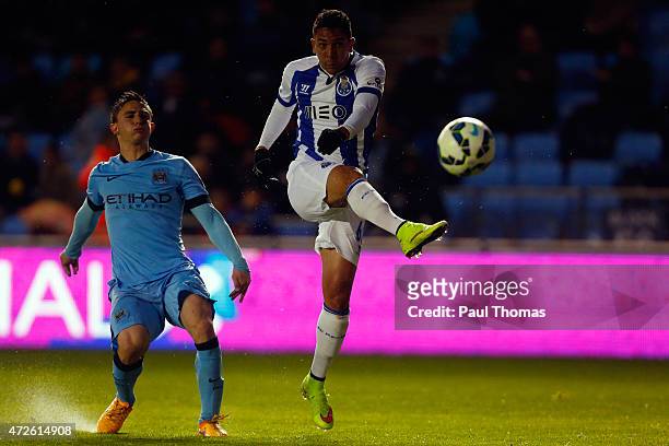 Anderson Oliveira of FC Porto shoots at goal past Pablo Maffeo of Manchester City during the Premier League International Cup Final match between...