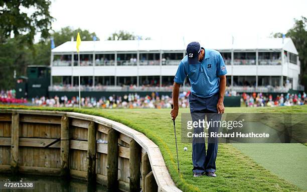 Matt Kuchar plays his second shot on the 17th hole backwards during round two of THE PLAYERS Championship at the TPC Sawgrass Stadium course on May...