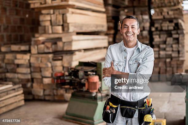 carpenter at his workshop - construction worker smiling stock pictures, royalty-free photos & images