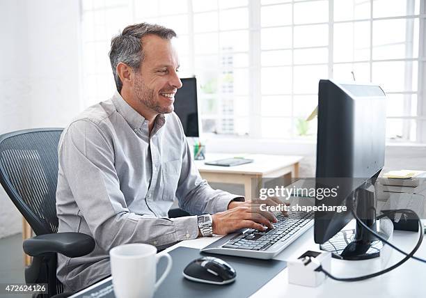 getting up to speed with online business - happy person looking at computer screen stock pictures, royalty-free photos & images