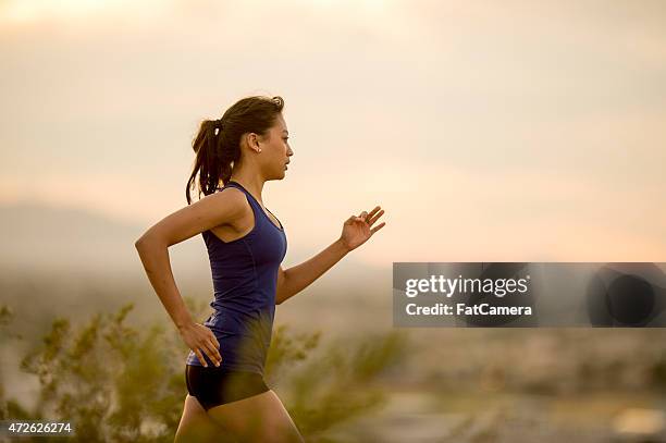 trail run at dusk - beautiful fat women stockfoto's en -beelden