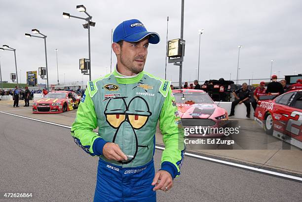 Casey Mears, driver of the Squidward Tentacles Chevrolet, stands on the grid during qualifying for the NASCAR Sprint Cup Series SpongeBob SquarePants...