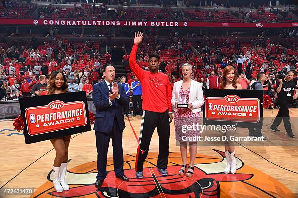 Jimmy Butler of the Chicago Bulls accepts his most improved player award prior to the game against the Cleveland Cavaliers at the United Center...