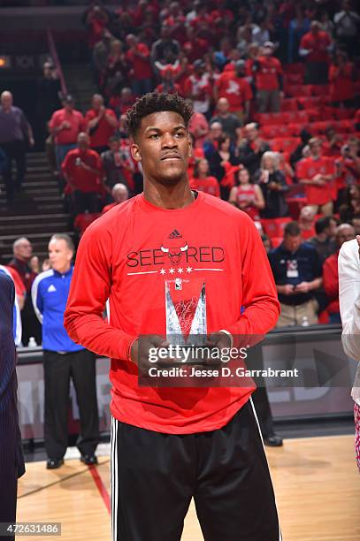 Jimmy Butler of the Chicago Bulls accepts his most improved player award prior to the game against the Cleveland Cavaliers at the United Center...