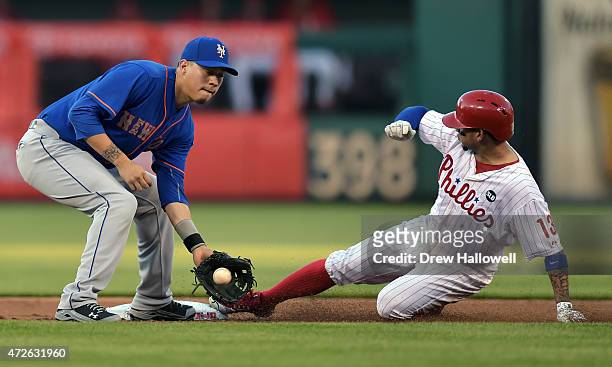 Wilmer Flores of the New York Mets catches the ball as Freddy Galvis of the Philadelphia Phillies slides safely into second base on a steal in the...